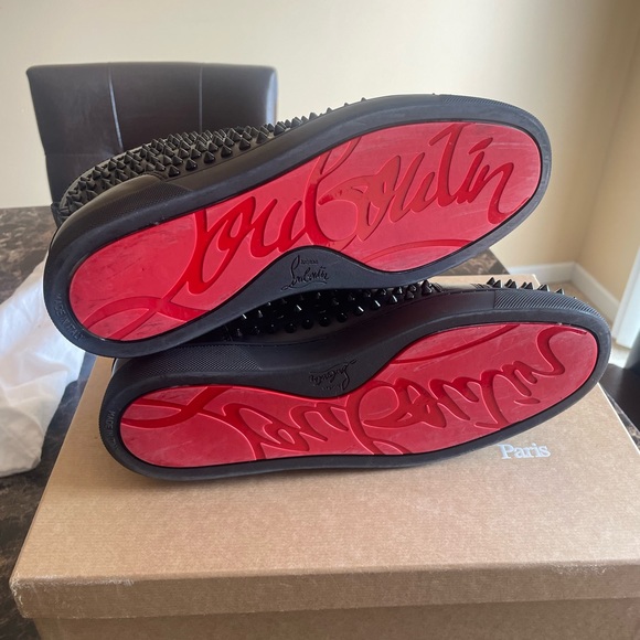 All black leather Christian Louboutin with spikes. No missing spikes.